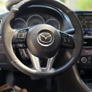 תפירת כיסוי הגה למאזדה 3 2008